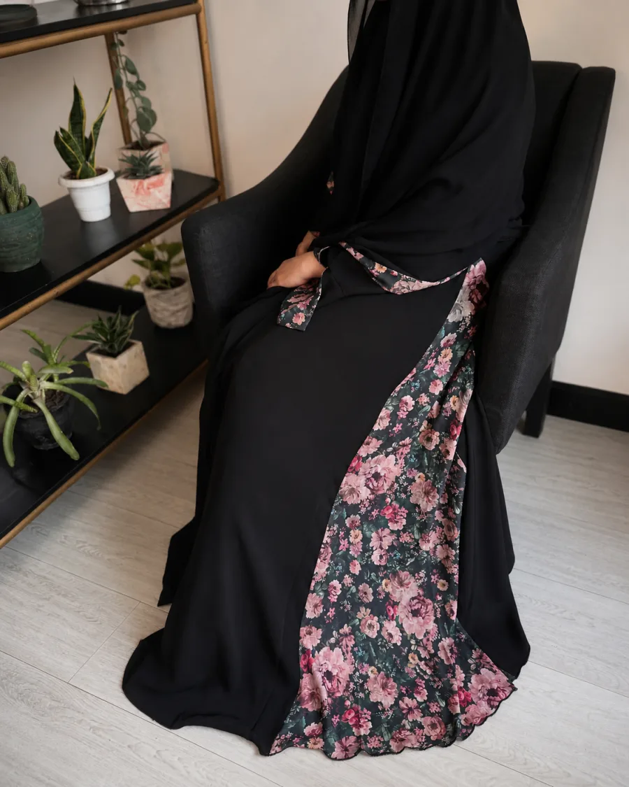 Hawrat editorial photography — abaya draped on a model in soft daylight