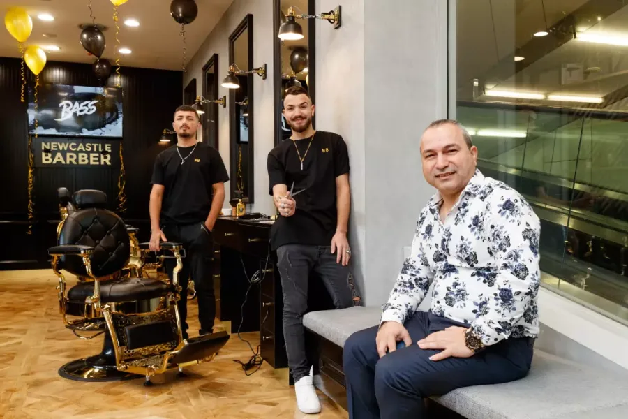 Newcastle Barber — team in their modern barbershop at opening day